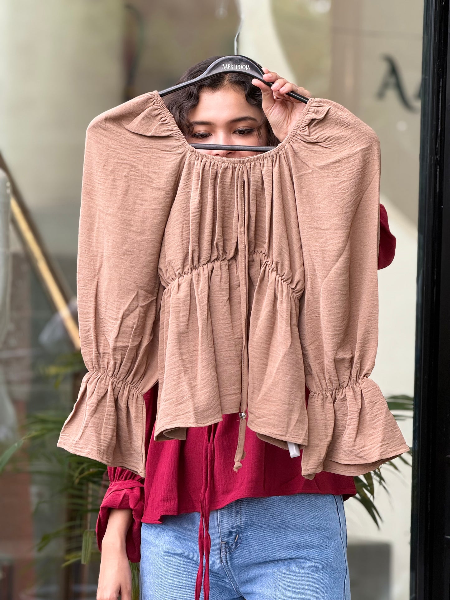 Women's Smocked Peplum Top with Tie-Up Neck and Flared Sleeves